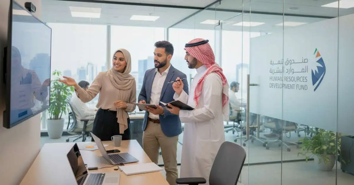Employment Support Program showing diverse Saudi employees working in modern office